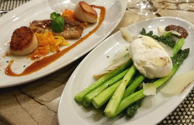 Treadwell's Pan Seared East Coast Scallops, caramelized cauliflower, guanciale, caper vinaigrette and Ontario Asparagus, poached “Bertha’s Bounty” egg , truffled burnt butter vinaigrette