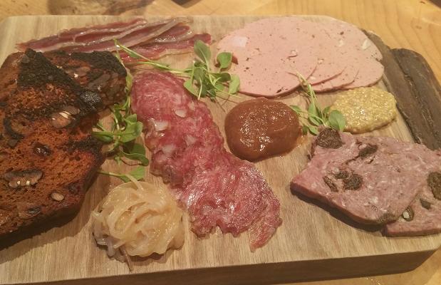 Le Caveau's Charcuterie Plate, house-made and locally sourced, served with chutney, shallot compote and spiced bread